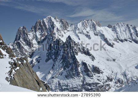 The Aiguille Verte above chamonix, and to the left, the two spikes The Drus.  The ridge to the right is the Droites and the Courtes. all of which are classic alpine climbs