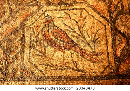 roman mosaic of a pheasant made from gold colored tiles in a roman temple dating from about 300 AD. The prominent ear feathers show that this is one of the eared pheasant family from china.