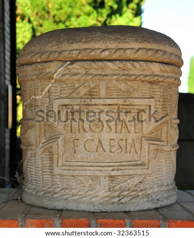 ancient roman burial urn including lid and jar for the ashes and bearing inscription for the decesased