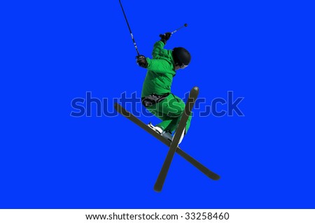 a Tele-hele. A skier executes a perfect crossed skis tele-heli during a high jump
