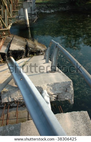remains of a bridge blown up by the retreating serbian army in order to try and prevent the advancing croatian army from crossing into Bosnia. A replacement pontoon bridge was erected by the US army