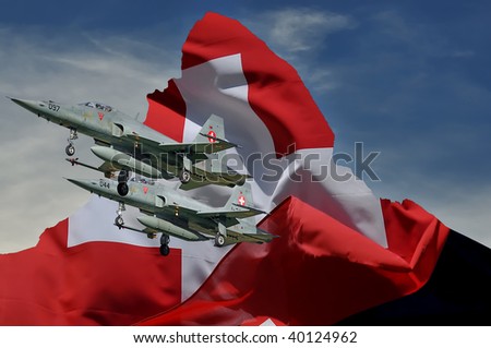 Two swiss jet fighters fly past swiss flag over the silhouette of the matterhorn as a symbol of patriotism, national pride and defense. the corner of the flag lifts in their wake