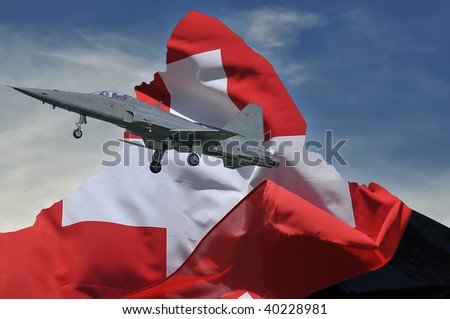 jet fighter fly past swiss flag over the silhouette of the matterhorn as a symbol of patriotism, national pride and defense. the corner of the flag lifts in their wake