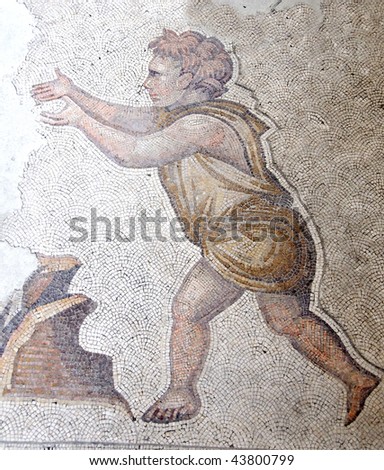 ancient byzantine mosaic in the great palace of constantinople showing a young boy running