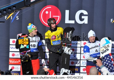 VEYSONNAZ, SWITZERLAND - JANUARY 15:  FIS World Championship Snowboard Cross finals. new world champion Pierre Vaultier, 2nd David Speiser, and Nick Baumgartner.  January 15 in Veysonnaz, Switzerland