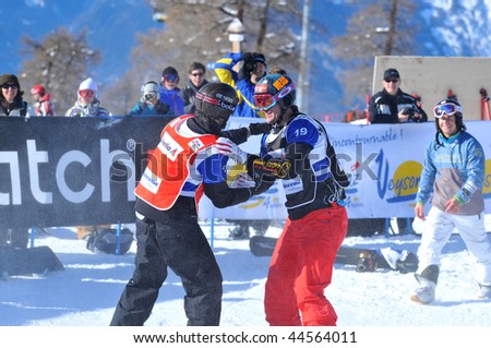 VEYSONNAZ, SWITZERLAND - JANUARY 15:  FIS World Championship Snowboard Cross finals. new world champion Pierre Vaultier, congratulates  2nd David Speiser.  January 15 in Veysonnaz, Switzerland