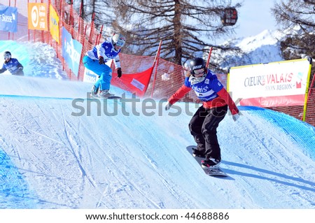 VEYSONNAZ, SWITZERLAND - JANUARY 15:  FIS World Championship Snowboard Cross finals. World Champion Helene Olafsen leads simona Meiler on January 15, 2010 in Veysonnaz, Switzerland