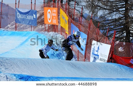 VEYSONNAZ, SWITZERLAND - JANUARY 15:  FIS World Championship Snowboard Cross finals. Finalist Maciej Jodko of Poland on January 15, 2010 in Veysonnaz, Switzerland