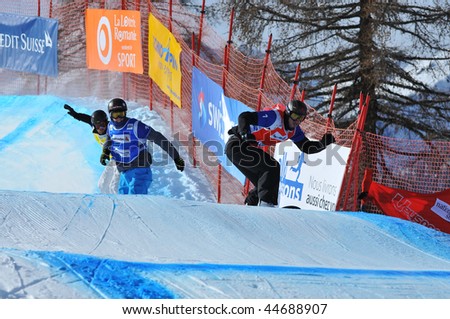 VEYSONNAZ, SWITZERLAND - JANUARY 15:  FIS World Championship Snowboard Cross finals. The winner, new world champion Pierre Vaultier on January 15, 2010 in Veysonnaz, Switzerland