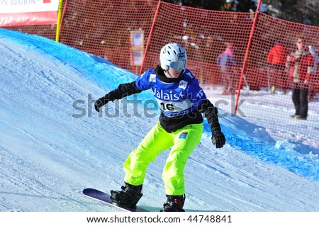 VEYSONNAZ, SWITZERLAND - JANUARY 15:  FIS World Championship Snowboard Cross finals. Finalist Zoe Gillings preparing a jump.  January 15 in Veysonnaz, Switzerland