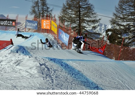 VEYSONNAZ, SWITZERLAND - JANUARY 15: World championship Snowboard cross  finals. World champion Pierre Vaultier leads the pack.  January 15 in Veysonnaz, Switzerland.