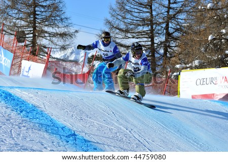 VEYSONNAZ, SWITZERLAND - JANUARY 15: World championship Snowboard cross  finals. Finalist Paul-Henri de le Rue leads Tony Ramoin of France. January 15 in Veysonnaz, Switzerland.