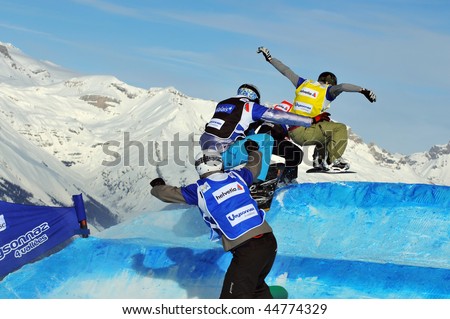 VEYSONNAZ, SWITZERLAND - JANUARY 15: World championship Snowboard cross  finals. Bonvin leads a pack over the jump including De le Rue and Holland. January 15 in Veysonnaz, Switzerland.
