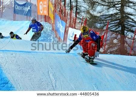 VEYSONNAZ, SWITZERLAND - JANUARY 15: World championship Snowboard cross  finals. Mellie Francon leads Tanja Frieden- small final winner. January 15 in Veysonnaz, Switzerland.