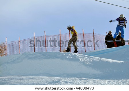 VEYSONNAZ, SWITZERLAND - JANUARY 15: World championship Snowboard cross  finals. Tanja Frieden leading Simona Meiler over the jump. January 15 in Veysonnaz, Switzerland.