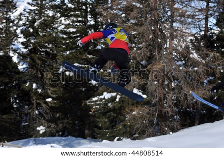 VEYSONNAZ, SWITZERLAND - JANUARY 15: World championship Snowboard cross  finals. Ladies world champion Helene Olafsen jumping. January 15 in Veysonnaz, Switzerland.
