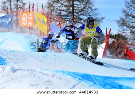 VEYSONNAZ, SWITZERLAND - JANUARY 15: World championship Snowboard cross  finals. Paul Henri de le Rue leads the pack.  January 15 in Veysonnaz, Switzerland.