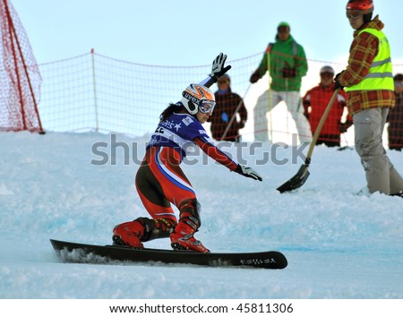NENDAZ, SWITZERLAND - JANUARY 17: world champion Tudegesheva of russia competes in the FIS World Championship Snowboard Giant Parallel Finals January 17, 2010 in Nendaz, Switzerland.
