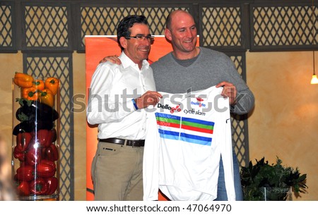 GENOVA, ITALY - FEBRUARY 16: Lawrence Dallaglio presents a cycling shirt to a vice president of SACLA Italy:  February 16, 2010 in Genova, Italy.
