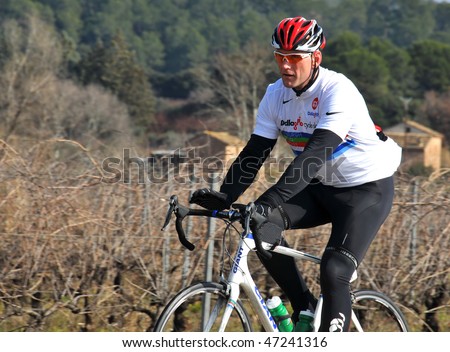 FREJUS, FRANCE- FEBRUARY 18: Lawrence Dallaglio cycles through vineyards during the Dallaglio Cycle Slam  February 18, 2010 in Frejus, France.