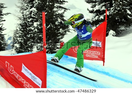 VEYSONNAZ, SWITZERLAND - JANUARY 15: World championship Snowboard cross  finals. Isabel clark Ribeiron on a jump. January 15 in Veysonnaz, Switzerland.