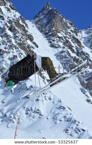 a skier performing a jump leans right back