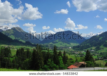 Panorama of Gstaad in switzerland, surrounded by mountains, prefered resort of the rich and famous