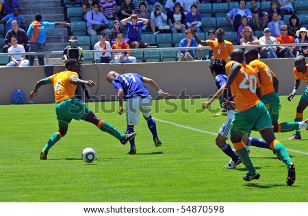 SION, SWITZERLAND - JUNE 4: Kolo Toure (4) defending for the Ivory Coast in a friendly match against Japan for the 2010 world cup:  June 4, 2010 in Sion Switzerland