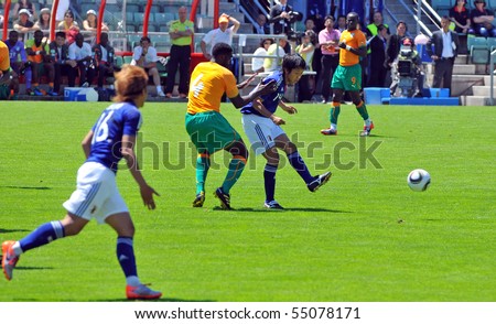 SION, SWITZERLAND - JUNE 4: Nakamura against Kolo Toure of the Ivory Coast in a friendly match against Japan for the 2010 world cup:  June 4, 2010 in Sion Switzerland