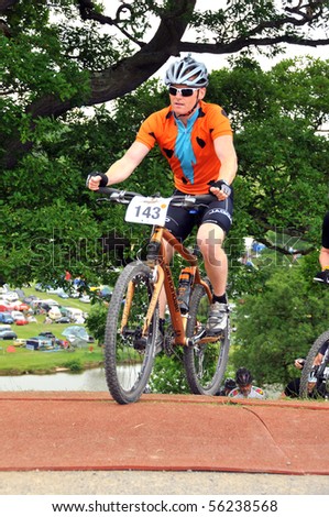 LEDBURY, UK-JUNE 19:An unidentified male competitor in the 24 hour 2010 Mountain Mayhem mountain bike competition: June 19, 2010 in Ledbury UK