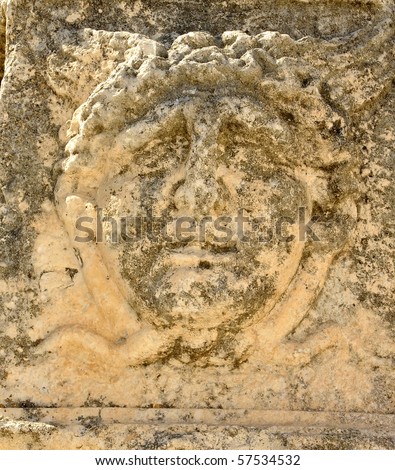 Ancient roman sculpture of a man\'s face looking very worried or concerned