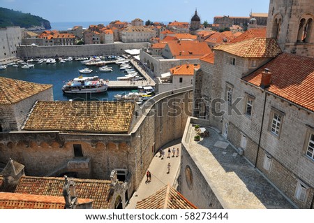 Harbour, walls and old parts to the UNESCO listed fortified town of Dubrovnik in Croatia.