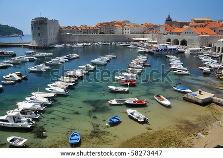 Clear water in the harbour at the entrance to the UNESCO listed town of Dubrovnik in Croatia