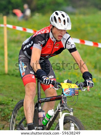 VERBIER, SWITZERLAND - AUGUST 21: Roland Danner one of the leaders in the famous Grand Raid mountain bike race:  August 21, 2010 in Verbier Switzerland