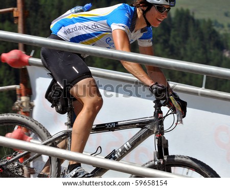 VERBIER, SWITZERLAND - AUGUST 21: Andrea Kuster, ladies silver medal in the  world famous Grand Raid mountain bike race:  August 21, 2010 in Verbier Switzerland