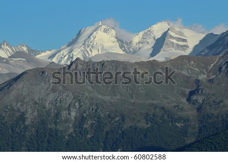 The  peaks of Dom (left) and Taschhorn (right) with the Nadelhorn far left, in the setting sun, in the southern swiss alps above Zermatt
