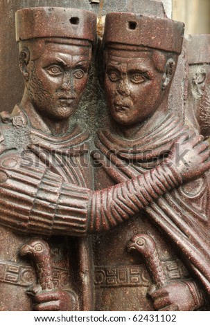 Two of the tetrarchs holding each other closely and trusting each other to share the power of the roman empire. 1700 year old sculpture in porphyry