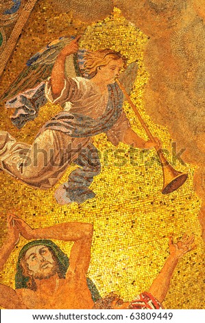 Mosaic of an angel with trumpet announcing the coming of God executed in golden mosaics