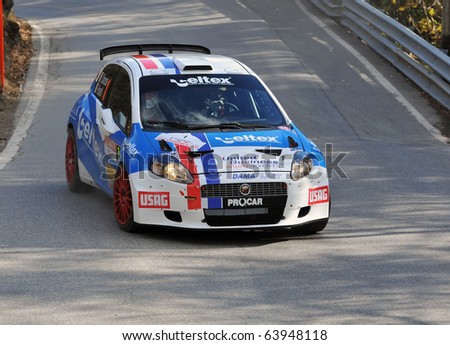 SION, SWITZERLAND - OCTOBER 28: the leader on Day 1, Stage 1 of the International Rally of the Valais Rossetti Luca in a fiat Punto: October 28, 2010 in Sion Switzerland