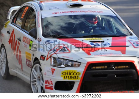 SION, SWITZERLAND - OCTOBER 28: Team Racing Fan\'s on Day 1, Stage 1 of the International Rally of the Valais in a mitsubishi Evo on October 28, 2010 in Sion Switzerland