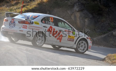 SION, SWITZERLAND - OCTOBER 28: Team Racing Fan's on Day 1, Stage 1 of the International Rally of the Valais takes a corner in smoke on October 28, 2010 in Sion Switzerland
