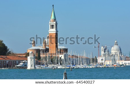 The bell tower and marina of St George in the Venice lagoon, on the Island of Saint George the great, Italy