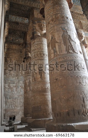 the main hypostyle hall with well preserved paint work at the  ancient Egyptian fertility and love temple of the goddess Hathor at Dendera, in Egypt