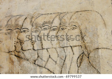 Ancient Egyptian unfinished sketches of men and women prior to paint being applied in the Tomb of Ramose in the necropolis of the nobles at thebes near Luxor, Egypt
