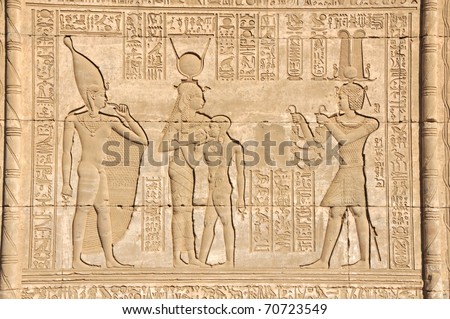 the ancient Egyptian fertility and love temple of the goddess Hathor with bas-relief showing the goddess suckling the son of pharaoh at Dendera, in Egypt
