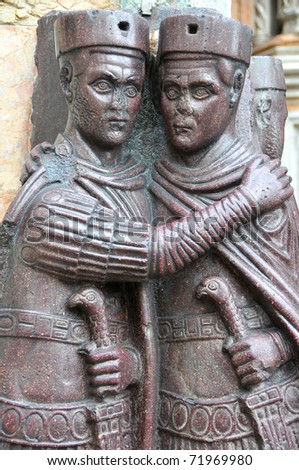 Two of the four Tetrarchs, emperors of the roman empire holding each other closely, and trusting each other to wield power