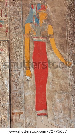 Painted bas-relief of Queen Hatshepsut in red dress at Thebes in Egypt