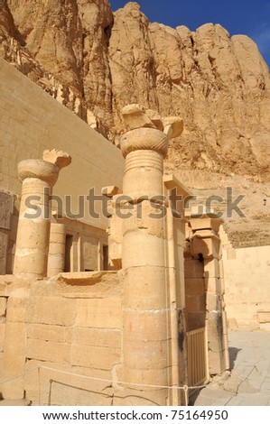 The inner sanctuary of the early new kingdom mortuary temple of Queen Hatshepsut at Thebes in Egypt in very fine sandstone, with mountains behind