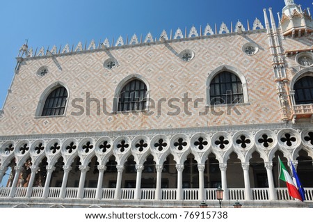 east end of the highly decorated first floor gallery and logia of the Doge\'s Palace in Venice, Italy. with Italian and european flags