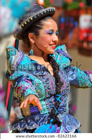 EVOLENE, SWITZERLAND - AUGUST 11: Pretty Peruvian dance girl in traditional costume at International Festival of Folklore and Dance(CIME) :  August 11, 2011 in Evolene Switzerland